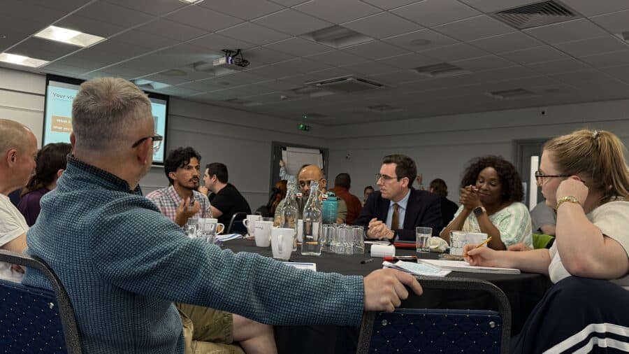 Dan Price meeting with members of the public